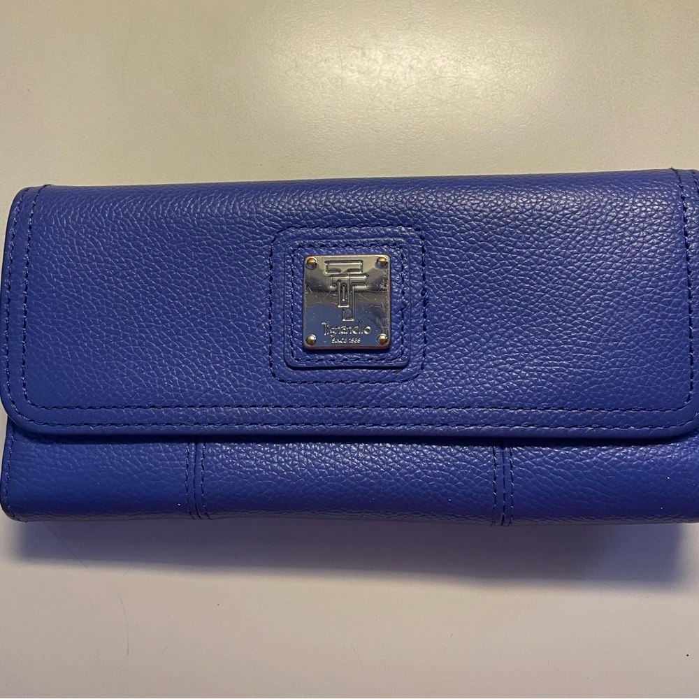 Ink blue Tignanello wallet with snap closure.